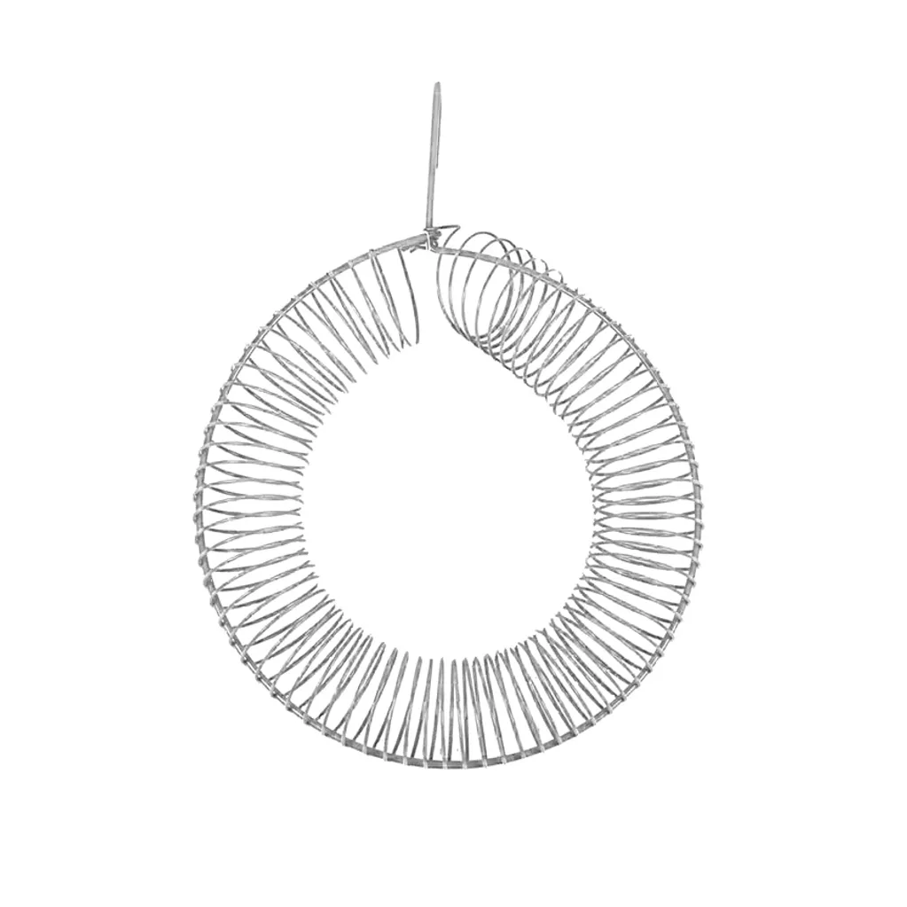 A circular metal coil spring hanging vertically by a string.