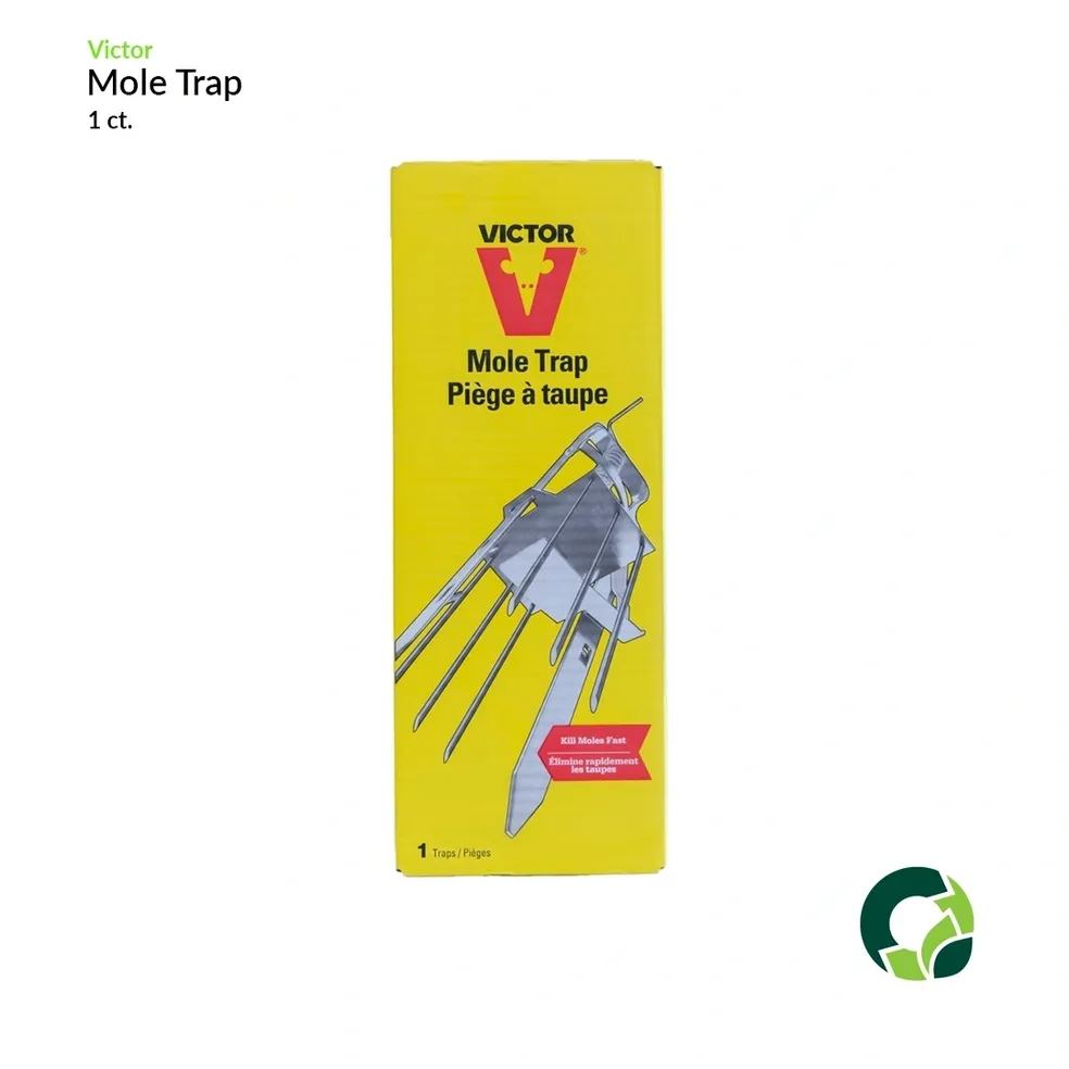 Yellow plastic mole trap in packaging.