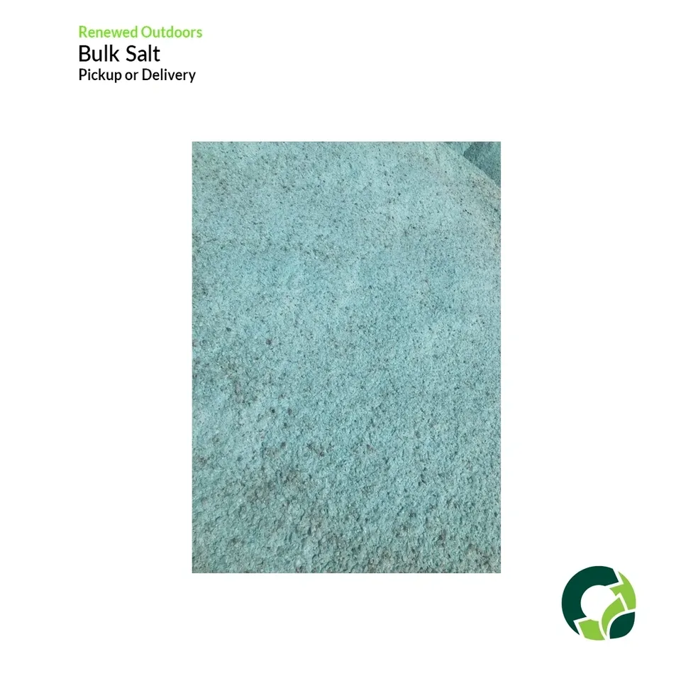 Close-up of bulk salt crystals with a light blue-green tint.