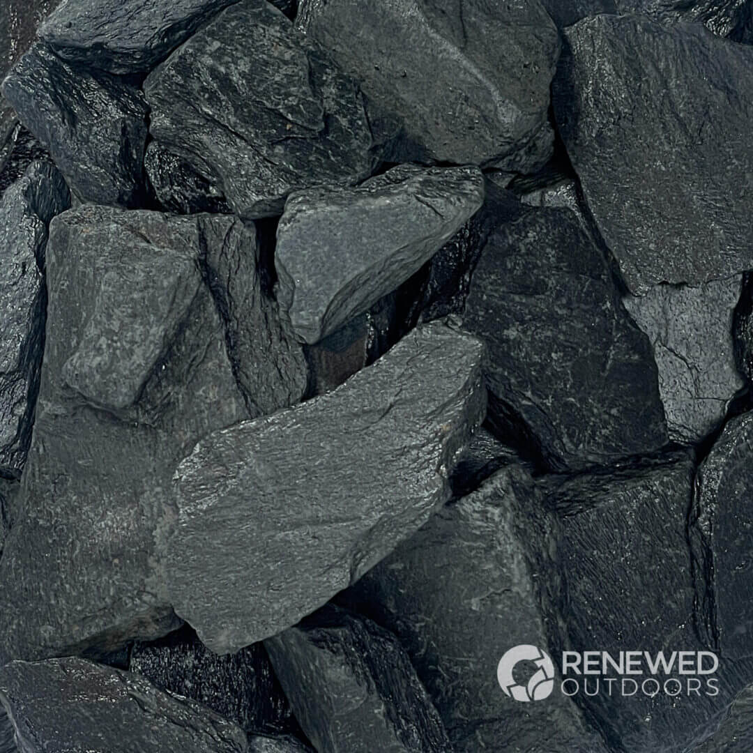 Pile of dark grey slate rocks.