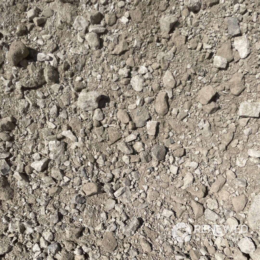 Rough gravel and stones on ground surface.