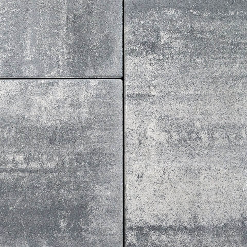 Gray concrete tiles with textured surface close-up.
