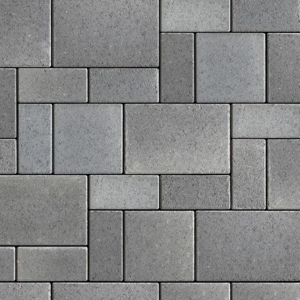 Gray stone paving pattern with rectangular blocks.