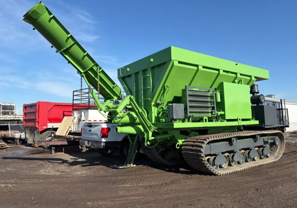 Large green tracked conveyor machine